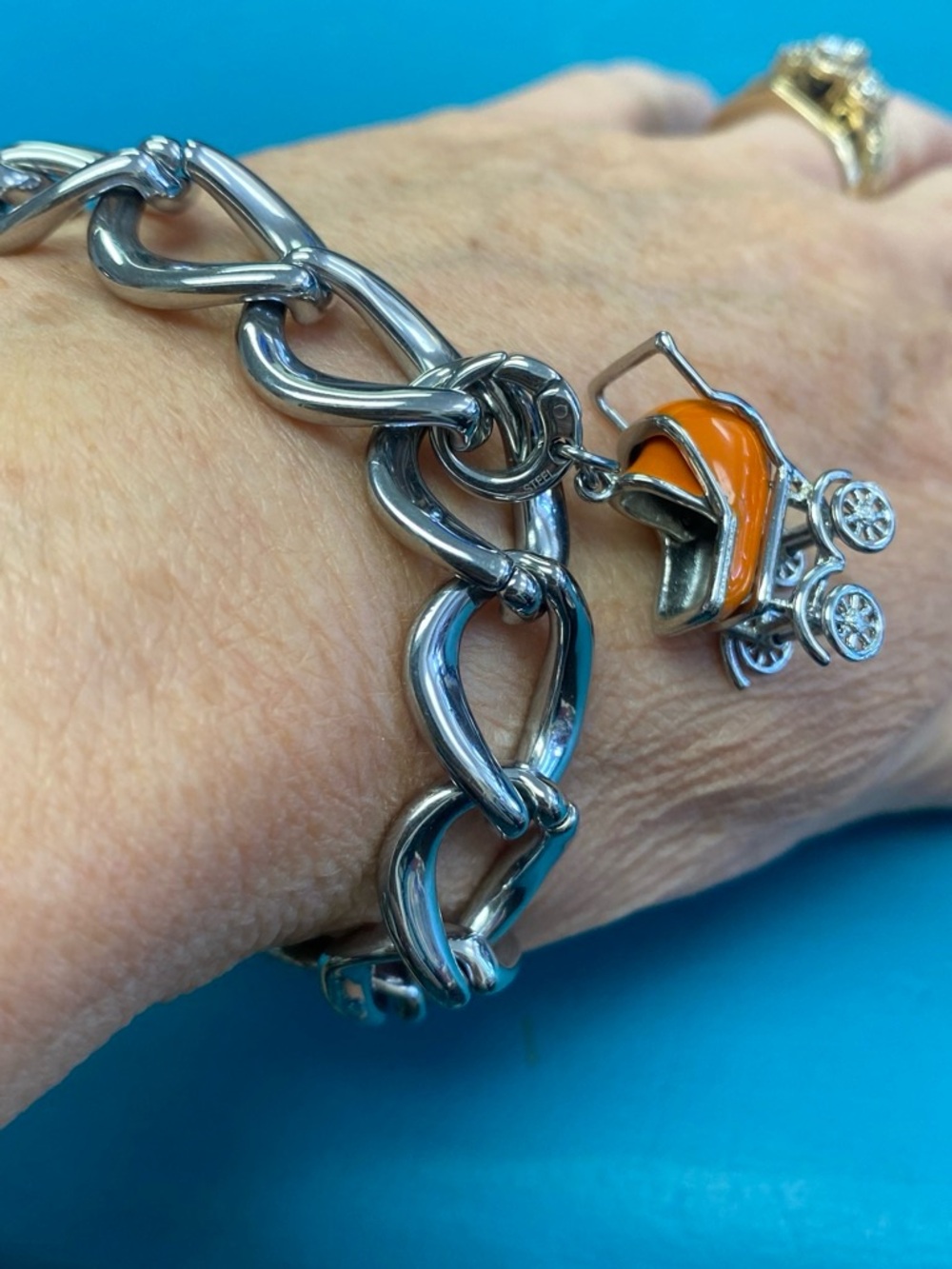 Fossil Chunky Silver Link Bracelet with Orange Stroller Charm